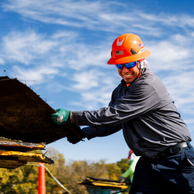 turner roofing employee works on commercial roof maintenance